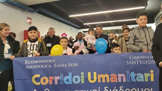 A group of 33 migrants in Fiumicino Airport in Rome, accompanied by Polish Cardinal Konrad Krajewski after being brought from the Greek island of Lesbos. With the help of the Community of Sant’Egidio and at the express request of the pope, these asylum seekers were welcomed in Italy Dec. 4, 2019. (Ines San Martín/Crux)