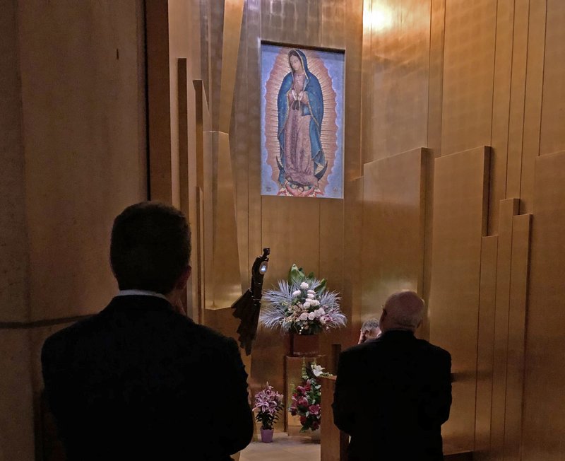 Faithful venerate the relic of the tilma of Our Lady of Guadalupe at the Cathedral of Our Lady of the Angels after the Chrism Mass April 15, 2019. (SARAH YAKLIC)