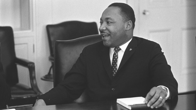 Civil rights leader the Rev. Martin Luther King Jr. smiles during a talk with U.S. President Lyndon B. Johnson, not pictured, in this undated photo. (CNS photo/Yoichi Okamoto, courtesy LBJ Library)