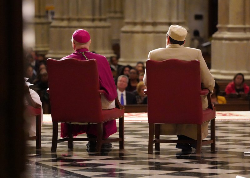 Auxiliary Bishop James Massa of Brooklyn, N.Y., and Dr. Tahir Kukiqi, imam of the Albanian Islamic Cultural Center in Staten Island, N.Y., attend an interfaith Thanksgiving prayer service Nov. 26, 2019, at St. Patrick's Cathedral in New York City. (CNS photo/Gregory A. Shemitz)