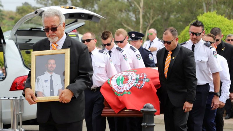 Firefighters from the Horsley Park Rural Fire Service carry the casket of volunteer firefighter Andrew O'Dwyer during his funeral Mass at Our Lady of Victories Catholic Church in Sydney Jan. 7, 2020. O'Dwyer died Dec. 19 when the truck he was traveling in rolled off the road after a tree fell in the town of Buxton. (CNS photo/NSW Rural Fire Service via Reuters)
