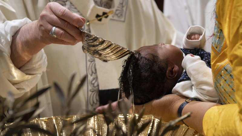 Pope Francis baptizes one of 27 babies during a Mass on the feast of the Baptism of the Lord in the Sistine Chapel at the Vatican Jan. 13, 2019. The Vatican has published Pope Francis' liturgical schedule, which includes baptizing infants and celebrating Mass in Bari, Italy, with bishops from Mediterranean countries. (CNS photo/Vatican Media)