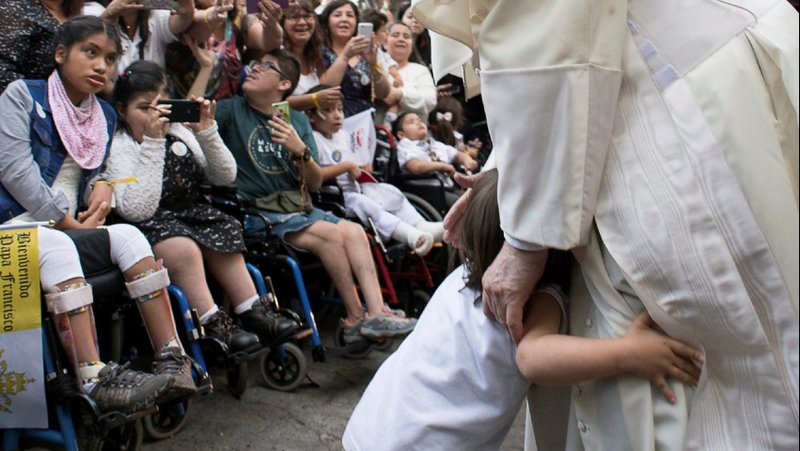 A child hugs Pope Francis outside the shrine of St. Alberto Hurtado in Santiago, Chile, Jan. 16, 2018. During his morning Mass Jan. 10, 2020, Pope Francis quoted the saint, who said, "It is good not to do evil, but it is evil not to do good." (CNS photo/L'Osservatore Romano via Reuters)