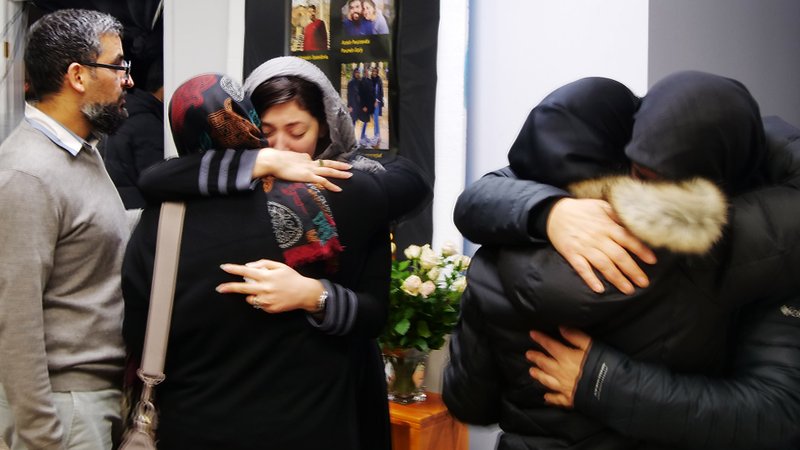 Family and friends embrace each other Jan. 11, 2020, at the Imam Hussein Islamic Society mosque in Edmonton, Alberta. (CNS photo/Andrew Ehrkamp, Grandin Media)