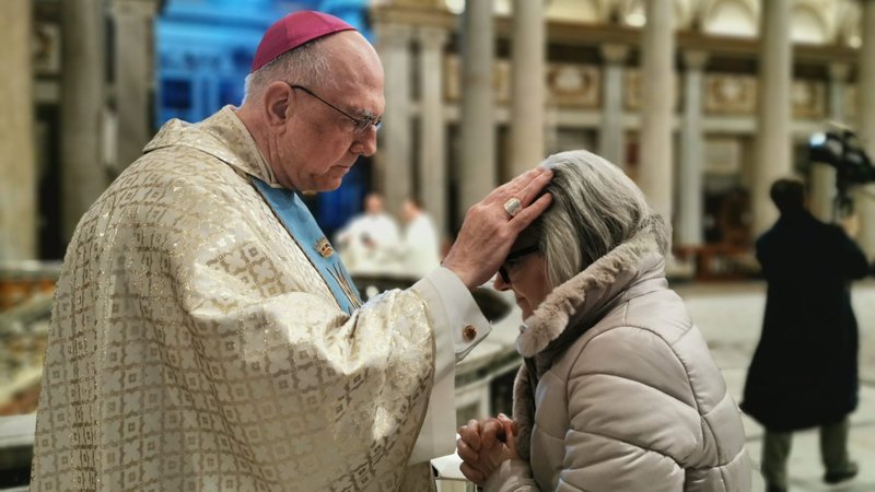 Archbishop Joseph F. Naumann of Jefferson City, Mo., blesses a woman after concelebrating Mass with U.S. bishops at the Basilica of St. Mary Major in Rome Jan. 14, 2020. (CNS photo/Junno Arocho Esteves)