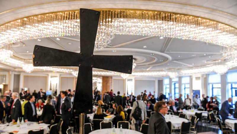 A cross is displayed during a meeting of the Central Committee of German Catholics in Bonn Nov. 22, 2019. Catholic leaders in Germany have compiled responses from lay Catholics in areas related to who holds power in the church, sexual morals, the role of priests and the place of women in church offices in preparation for an upcoming synodal assembly to debate church reforms. (CNS photo/Harald Oppitz, KNA)