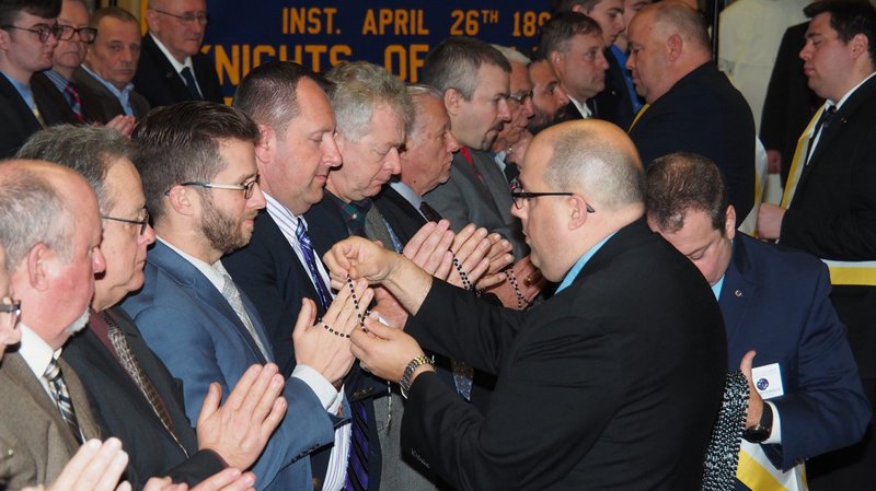 Members of the Knights of Columbus receive rosaries Jan. 1, 2020, as part of the organization's new ceremony that is designed to condense the Knights of Columbus' three degrees into one. In addition, the ceremony is now conducted in public instead of in a secret, members-only occasion. (CNS photo/courtesy Joe Cullen)