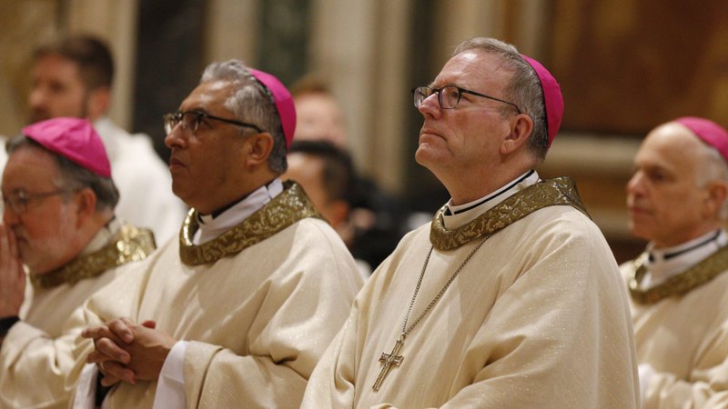 Auxiliary Bishop Robert E. Barron of Los Angeles, right, and other bishops from California, Hawaii and Nevada concelebrate Mass at the Basilica of St. Mary Major while making their "ad limina" visits in Rome Jan. 30, 2020. The bishops were making their "ad limina" visits to report on the status of their dioceses to Pope Francis and Vatican officials. (CNS photo/Paul Haring)