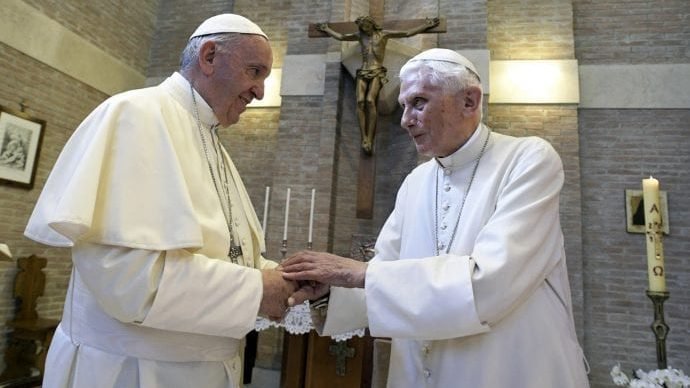 In this June 28, 2017 file photo, Pope Francis, left, and Pope Benedict XVI, meet each other on the occasion of the elevation of five new cardinals at the Vatican. Retired Pope Benedict XVI has broken his silence to reaffirm the value of priestly celibacy, contributing to a bombshell book at the precise moment that Pope Francis is weighing whether to allow married men to be ordained to address the Catholic priest shortage. (L'Osservatore Romano/AP via Crux)