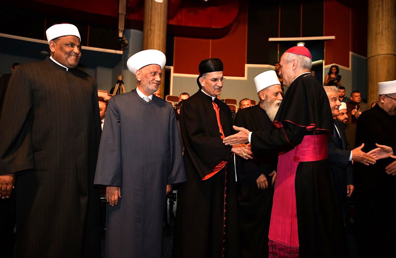 Archbishop Gabriele Caccia greets religious leaders during an interfaith conference at Notre Dame University Louaize in Zouk Mosbeh, Lebanon, in 2017, as the former Vatican nuncio to Lebanon. (Courtesy Mychel Akl/Maronite Catholic Patriarchate via Catholic News Service)