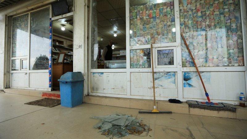 A man looks at a shattered glass window of a shop in the Iraqi province of Dahuk, Iraq, Jan. 8, 2020, after a missile launched by Iran against U.S.-led coalition forces. Iran attacked two bases in Iraq that house American troops with a barrage of missiles early Jan. 8 in retaliation for the U.S. killing an Iranian general Jan. 3. (CNS photo/Ari Jalal, Reuters)