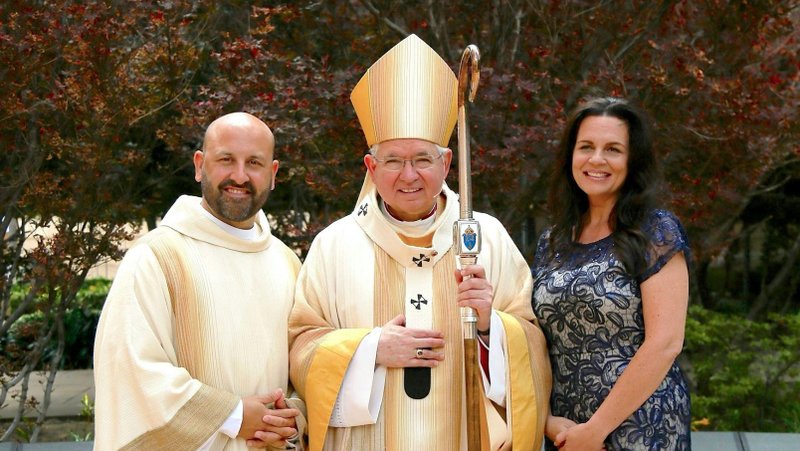 Jess Echeverry and her husband, Charlie Echeverry, with Archbishop José H. Gomez at Charlie's diaconate ordination June 10, 2017. (Photo courtesy Jess Echeverry)