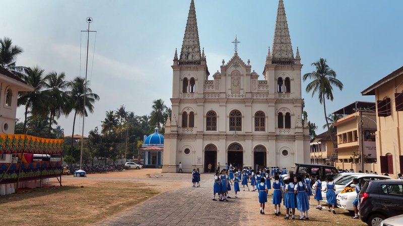 Indian young schoolgirls near the Santa Cruz basilica colonial Church in Fort Kochi. (Elena Odareeva/Shutterstock)