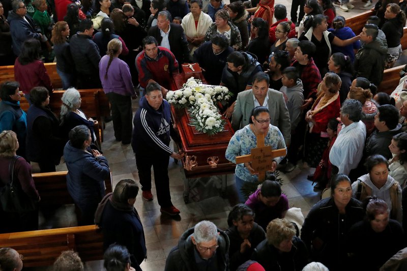 The casket of Cesar Jimenez Brito, 40, who was killed during a pipeline explosion, is carried during his Jan. 20, 2019, funeral at a Catholic church in Tlahuelilpan, Mexico.(CNS photo/Henry Romero, Reuters)