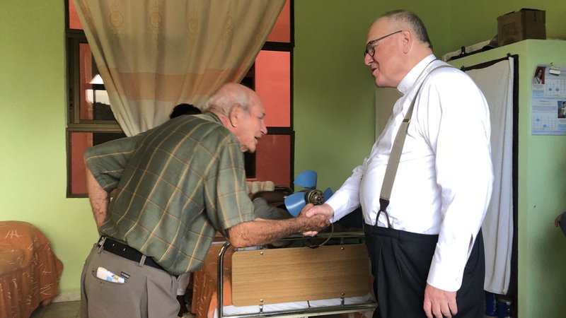 New York Cardinal Timothy M. Dolan shakes the hand of man who lives in a home for the elderly after the cardinal celebrated Mass at the Monsenor Alfonso Rodriguez Center in Camaguey, Cuba, Feb. 9, 2020. The archbishop of New York was in the midst of a six-day mission visit, his first to the island. (CNS photo/Rhina Guidos)