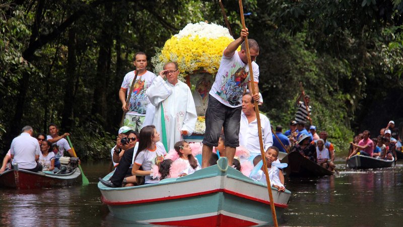 Pilgrims travel in boats as they accompany the statue of Our Lady of Nazareth during an annual river procession and pilgrimage along the Apeu River to a chapel in Macapazinho, Brazil, Aug. 3, 2014. The Vatican released Pope Francis' postsynodal apostolic exhortation, "Querida Amazonia" (Beloved Amazonia), Feb. 12, 2020. (CNS photo/Ney Marcondes, Reuters)