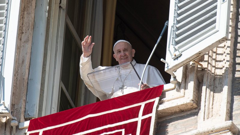Pope Francis greets the crowd as he leads the Angelus from the window of his studio overlooking St. Peter's Square at the Vatican Feb. 16, 2020. (CNS photo/Vatican Media)