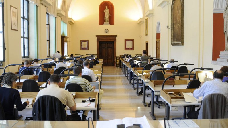 Scholars review materials in the Vatican Secret Archives in this undated photo. After decades of anticipation, the Vatican is opening its archives on the World War II pontificate of Pope Pius XII. (CNS photo/courtesy Vatican Secret Archives)