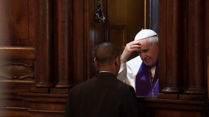 Pope Francis hears the confession of a priest March 7, 2019, at Rome's Basilica of St. John Lateran. Reconciling oneself to God leads to healing, the pope said in his annual Lenten message, released by the Vatican Feb. 24, 2020. (CNS photo/Vatican Media)