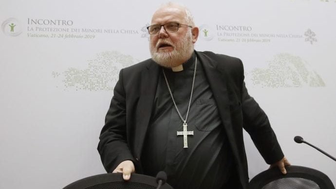In this Saturday, Feb. 23, 2019 file photo, Cardinal Reinhard Marx leaves at the end of a media briefing during a four-day sex abuse summit called by Pope Francis in Rome, Italy. Marx, head of the German Bishops Conference, says he will step down at the end of his term in March. (Alessandra Tarantino/AP via Crux)
