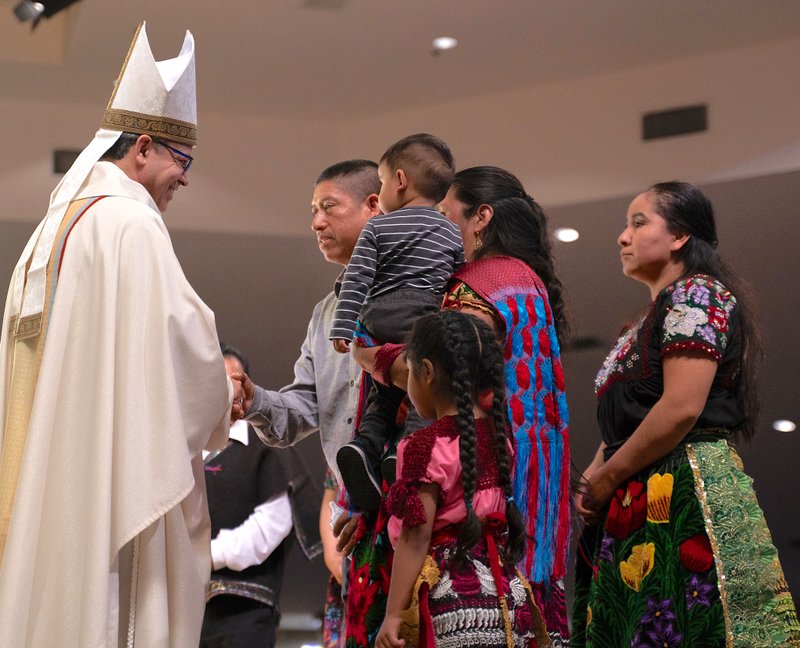 At the start of the Mass of Welcome, representatives of six different communities presented Bishop Rojas with a gift while identifying their community. (Diocese of San Bernardino)