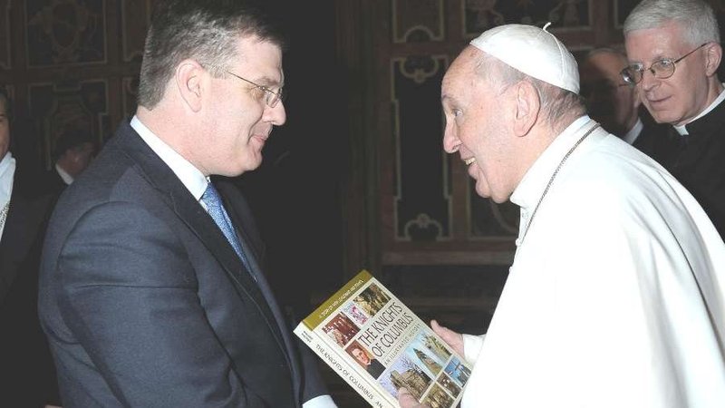 Andrew Walther presents "The Knights of Columbus: An Illustrated History" to Pope Francis. (Courtesy photo via CNA)