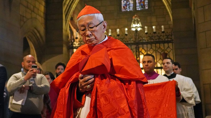Cardinal Joseph Zen Ze-kiun, 88, retired bishop of Hong Kong, holds a biretta and wears a cappa magna ("great cape") as he processes prior to celebrating a Pontifical High Mass Feb. 15, 2020, at St. Vincent Ferrer Church in New York City. The liturgy preceded the third annual Lepanto Conference, a one-day event featuring speakers who discussed the history, beauty and sacredness of the traditional Latin Mass. (CNS photo/Gregory A. Shemitz)