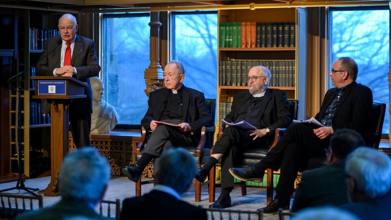 John Borelli, special assistant for Catholic identity and dialogue to President John J. DeGioia of Georgetown University in Washington, moderates a Feb. 25, 2020, panel on the celebration of St. John Henry Newman's life and writings at Georgetown. Also pictured are Jesuit Father John W. O'Malley, professor in Georgetown's theology department; the Rev. Mark Chapman, an Anglican priest, who a professor of the history of modern theology at the University of Oxford; and Frederick D. Aquino, a professor of theology and philosophy in the graduate school of theology at Abilene Christian University in Texas. (CNS photo/Rafael Suanes, courtesy Georgetown University)
