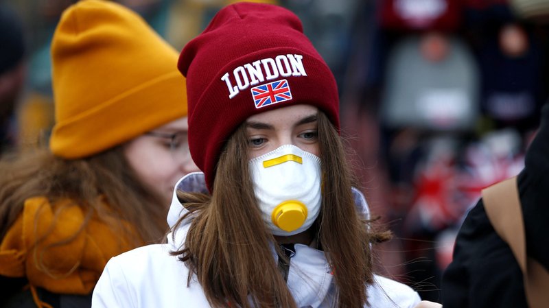 A girl wearing a coronavirus-related protective face mask is pictured in London March 2, 2020. (CNS photo/Henry Nicholls, Reuters)