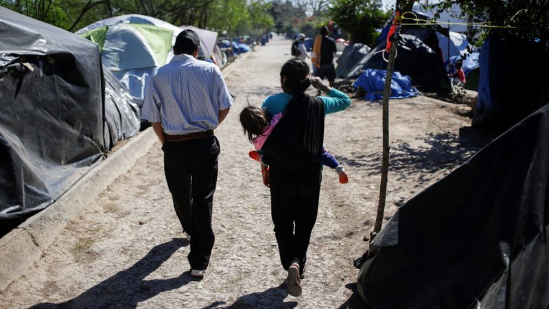 Migrants, who are asylum-seekers sent back to Mexico from the U.S. under the Trump administration's "Remain in Mexico" policy, are seen at provisional campsite near the Rio Bravo in Matamoros, Mexico, Feb. 27, 2020. The policy is officially named Migrant Protection Protocols, or MPP. (CNS photo/Daniel Becerril, Reuters)