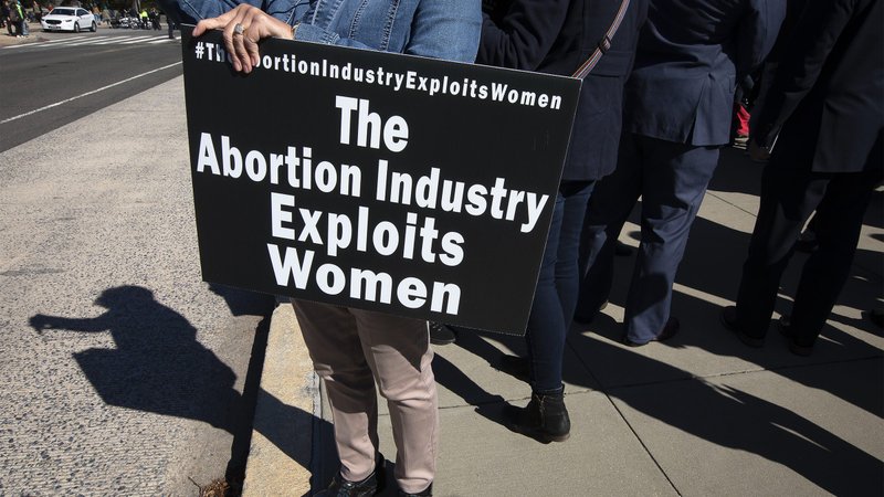 A pro-life demonstrator near the U.S. Supreme Court in Washington broadcasts live onto social media March 4, 2020. The court heard oral arguments that same day in June Medical Services v. Russo, a challenge to a Louisiana law, passed in 2014, that requires abortion providers to have "active admitting privileges" at a hospital within 30 miles of the abortion facility. (CNS photo/Tyler Orsburn)