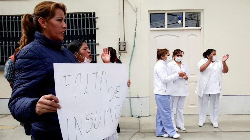 Health workers at Boliviano Holandes Hospital in El Alto, Bolivia, demand better resources to help coronavirus patients March 12, 2020. Archbishop Sergio Alfredo Gualberti Calandrina of Santa Cruz, Bolivia, has called for solidarity as the number of COVID-19 cases increase. (CNS photo/David Mercado, Reuters)