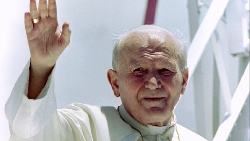 St. John Paul II waves farewell to the people of Papua New Guinea from the steps to his aircraft Jan. 18, 1995. March 25, 2020, marks the 25th anniversary of his prophetic encyclical "Evangelium vitae" ("The Gospel of Life").