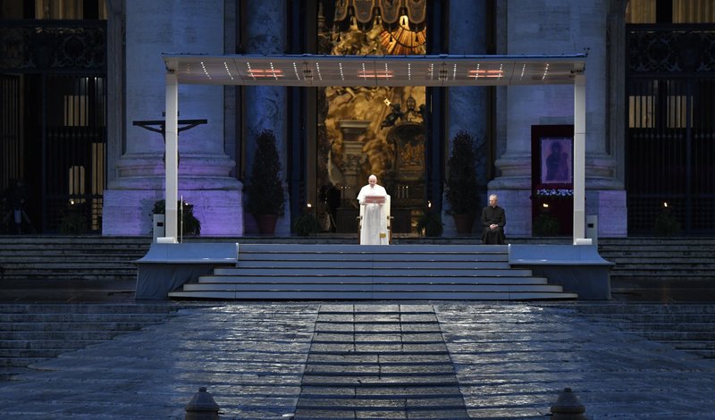 Pope Francis leads a prayer service in an empty St. Peter's Square at the Vatican March 27, 2020. At the conclusion of the service the pope held the Eucharist as he gave an extraordinary blessing "urbi et orbi" (to the city and the world). The service was livestreamed in the midst of the coronavirus pandemic. (CNS photo/Vatican Media)