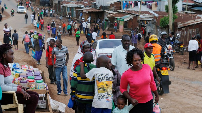 People walk to their houses in a poor neighborhood of Nairobi, Kenya, March 27, 2020. Kenyan President Uhuru Kenyatta ordered a curfew to contain the spread of COVID-19. (CNS photo/Thomas Mukoya, Reuters)