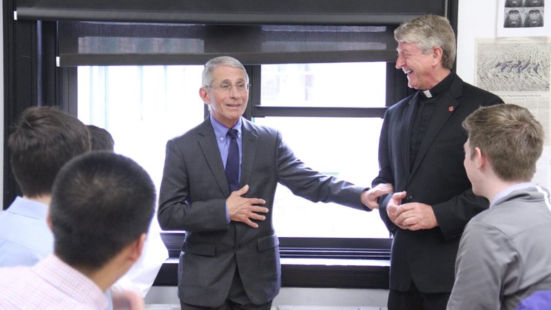 Dr. Anthony Fauci meets with New York City's Regis High School students and the school's president, Jesuit Father Daniel Lahart, in 2019. Fauci, who is the director of the National Institute of Allergy and Infectious Diseases, is a 1958 graduate of Regis. (CNS photo/courtesy Regis High School)