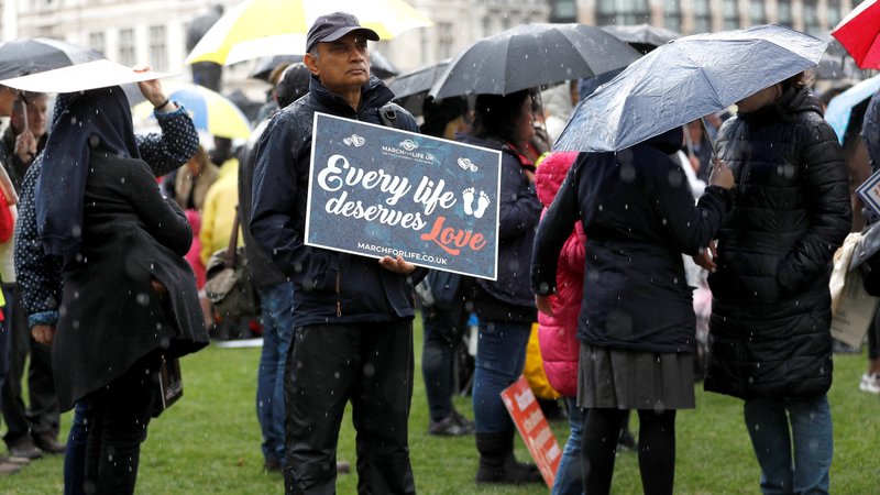 A pro-life demonstrator holds a placard during the March For Life rally in London May 11, 2019. The English bishops have express their shock at an emergency policy to allow "do-it-yourself abortions" during the 2020 coronavirus pandemic. (CNS photo/Peter Nicholls, Reuters)