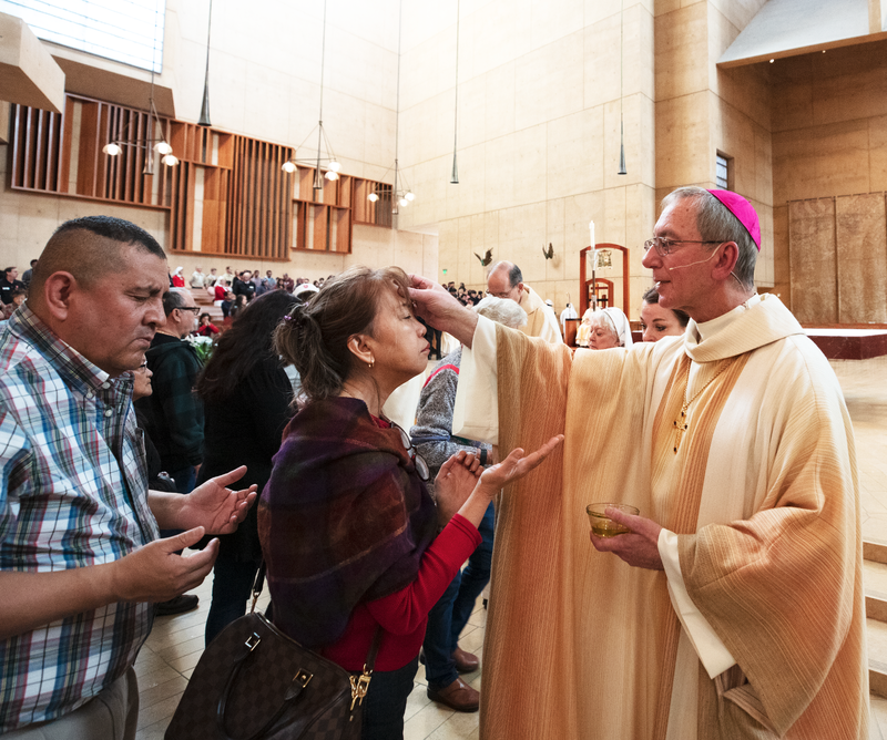 Auxiliary Bishop Marc V. Trudeau anoints a woman at the World Day of the Sick Mass at the Cathedral of Our Lady of the Angels Feb. 8, 2020. (Victor Alemán)