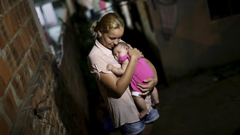 Gleyse Kelly da Silva poses for a photo in 2016 with her daughter Maria Giovanna, who has microcephaly, in Recife, Brazil. (CNS photo/Ueslei Marcelino, Reuters)