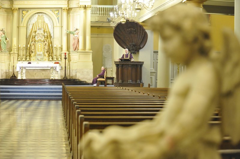 Deacon Richard Brady delivers the homily at a private Mass March 17, 2020, inside the empty, 950-seat St. Louis Cathedral in New Orleans. New Orleans Archbishop Gregory M. Aymond canceled all public Masses in the archdiocese to slow the spread of coronavirus. (CNS photo/Peter Finney Jr., Clarion Herald)