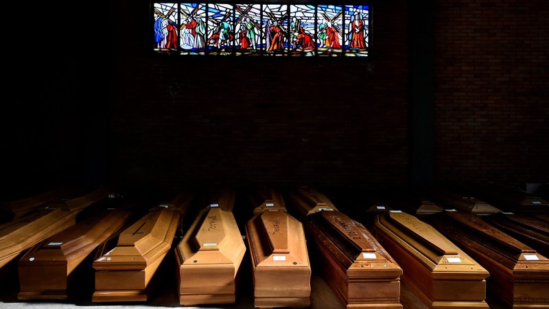 Coffins of people who have died from the coronavirus disease are seen in Alessandria, Italy, March 23, 2020. (CNS photo/Flavio Lo Scalzo, Reuters)