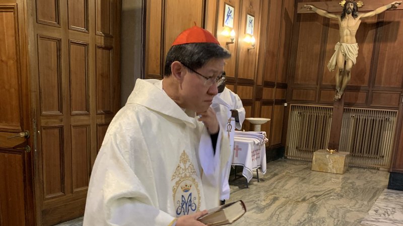 Cardinal Luis Antonio Tagle, prefect of the Congregation for the Evangelization of Peoples and president of Caritas Internationalis, prepares for Mass March 25, 2020, in the sacristy of the Pontifical Filipino College in Rome. Celebrating Mass at the college a few days later, Cardinal Tagle raised the possibility of declaring a "jubilee" of debt forgiveness because of the coronavirus pandemic. (CNS photo/courtesy of Father Alfonso Alojipan)