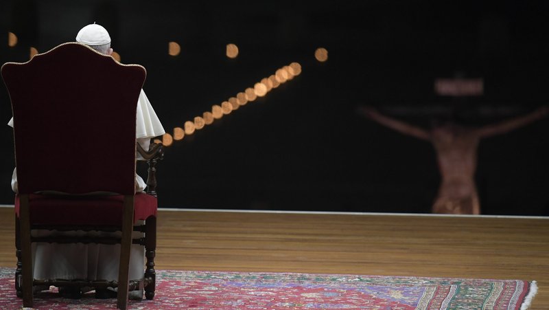 Pope Francis prays as he leads the Via Crucis procession in St. Peter's Square at the Vatican April 10, 2020. The Good Friday service was held with no public participation because of the COVID-19 pandemic. (CNS photo/Vatican Media)