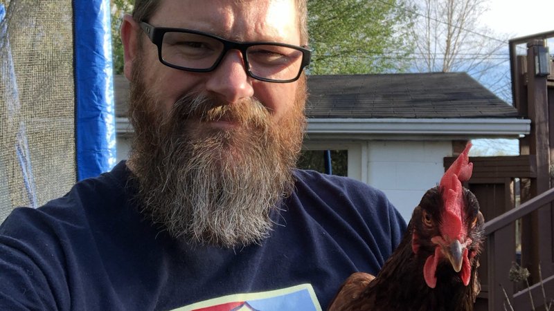 Gregory K. Hillis, professor of theology at Bellarmine University in Louisville, Ky., takes a selfie April 22, 2020, with his hen, Mag. The professor said his post-pandemic resolution is to stop "trying to control that which is ultimately uncontrollable." (CNS photo/courtesy of Gregory Hillis)