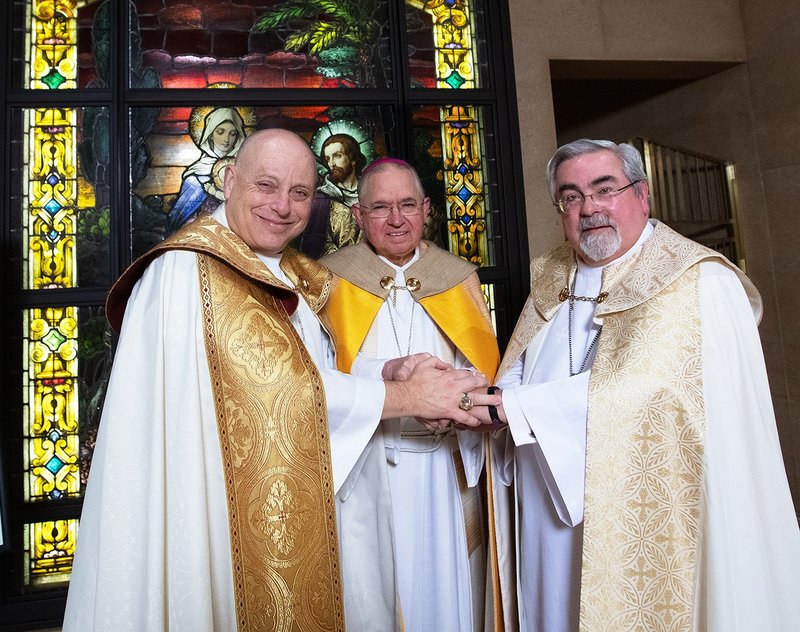Episcopalian Bishop John Taylor (left) and Lutheran Bishop R. Guy Erwin (right) pose with Archbishop José H. Gomez Jan. 18, 2019 to mark the anniversary of the signing of “One Lord, One Faith, One Baptism” by their predecessors in Los Angeles 25 years ago. (Victor Alemán)