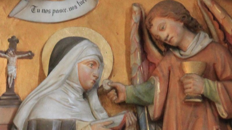 Saint Agnes miraculously receiving the Blessed Sacrament from an angel. (Wikipedia)