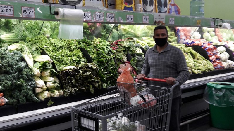 Knight of Columbus Jose Escobar purchases food for a homebound senior as part of the new "Hearts to Serve" initiative. (Archdiocese of Los Angeles)