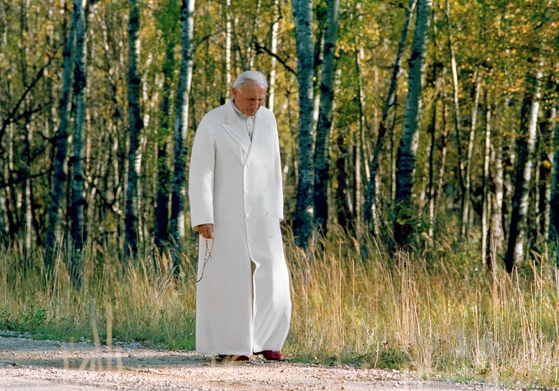 St. Pope John Paul II praying the rosary while on a walk in Alberta, Canada, circa 1984. (© L'Osservatore Romano)