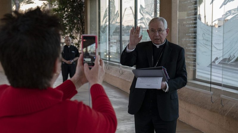 Archbishop José H. Gomez imparts a blessing before the lighting of candles in support of medical workers and their families. (Sarah Yaklic)