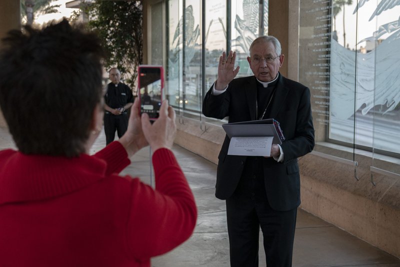 Archbishop José H. Gomez imparts a blessing before the lighting of candles in support of medical workers and their families. (Sarah Yaklic)